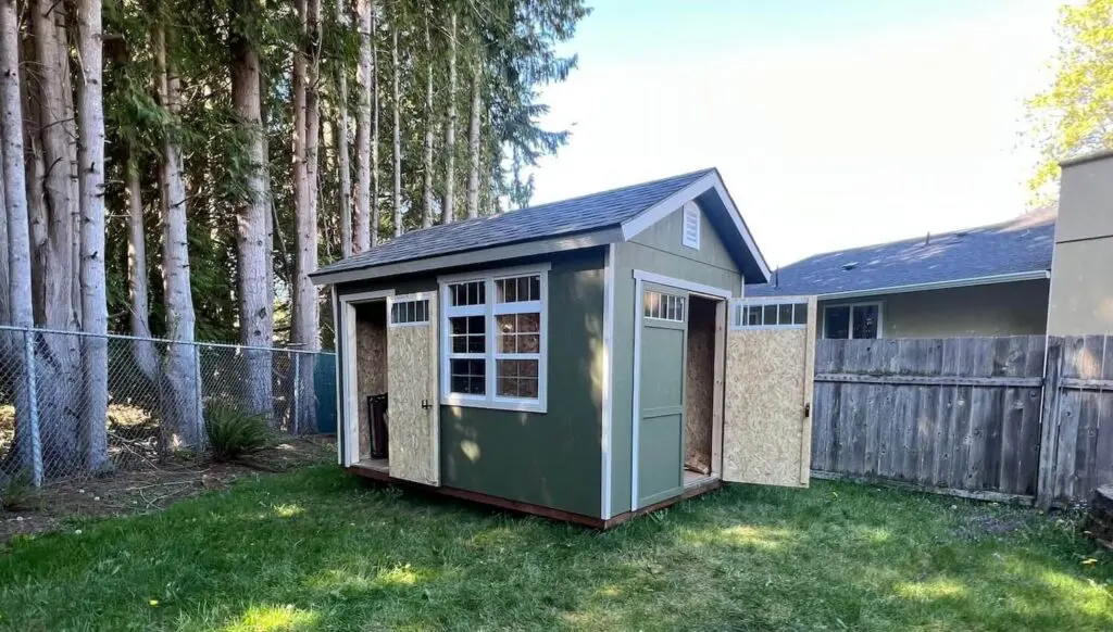 Repainted backyard shed matching the main house exterior in Maple Valley WA horizontal