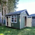 Repainted backyard shed matching the main house exterior in Maple Valley WA horizontal