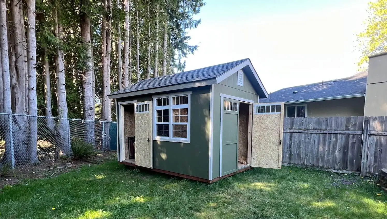 Repainted backyard shed matching the main house exterior in Maple Valley WA horizontal